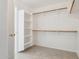 Large walk-in closet featuring shelving and hanging racks for ample storage at 11351 N 153Rd Dr, Surprise, AZ 85379