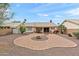 Expansive backyard featuring desert landscaping, a covered patio, and a built-in grill at 11925 N 67Th Dr, Peoria, AZ 85345