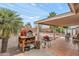 Inviting backyard patio with pizza oven, grill, and ample space for outdoor entertaining on a sunny day at 11925 N 67Th Dr, Peoria, AZ 85345