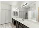 Elegant bathroom with double sinks, a large mirror, and a separate shower and tub at 11925 N 67Th Dr, Peoria, AZ 85345
