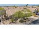 Beautiful tile roof with desert landscaping surrounding property at 12749 E Poinsettia Dr, Scottsdale, AZ 85259