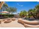Backyard patio featuring a cozy fire pit, seating, and a luxurious hot tub at 12749 E Poinsettia Dr, Scottsdale, AZ 85259