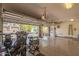 Spacious three-car garage with an open door, storage racks, and ample space for vehicles at 12749 E Poinsettia Dr, Scottsdale, AZ 85259