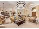 Expansive open-concept living area with high ceilings, hardwood floors, and abundant natural light at 12749 E Poinsettia Dr, Scottsdale, AZ 85259