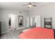 Primary bedroom with geometric rug, ceiling fan, ensuite bathroom, and walk-in closet at 1425 E Darrel Rd, Phoenix, AZ 85042