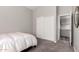 Bedroom with neutral walls, carpet flooring, and sliding closet doors at 1425 E Darrel Rd, Phoenix, AZ 85042