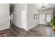 Entry hallway featuring laminate flooring, neutral paint, and a view into other rooms at 1425 E Darrel Rd, Phoenix, AZ 85042