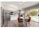Open kitchen and breakfast nook with stainless appliances and backyard pool view at 1425 E Darrel Rd, Phoenix, AZ 85042