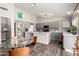 Bright kitchen with gray cabinets, stainless steel appliances, and a glass dining table at 1425 E Darrel Rd, Phoenix, AZ 85042