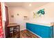Bright and airy living area with a table, a comfortable workspace, and modern, colorful decor at 1425 E Darrel Rd, Phoenix, AZ 85042