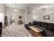 Inviting living room with a modern chandelier, plush sectional sofa, and neutral decor at 1425 E Darrel Rd, Phoenix, AZ 85042