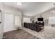 Comfortable living room with wood floors, neutral colors, and a view of the front door at 1425 E Darrel Rd, Phoenix, AZ 85042