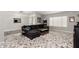 Comfortable living room featuring a large sectional sofa, stylish rug, and ample natural light at 1425 E Darrel Rd, Phoenix, AZ 85042