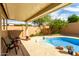 Inviting backyard pool area perfect for relaxation and outdoor enjoyment, enhanced by colorful plants and comfortable seating at 1425 E Darrel Rd, Phoenix, AZ 85042