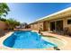 Private backyard oasis with a sparkling swimming pool and covered patio area at 1425 E Darrel Rd, Phoenix, AZ 85042