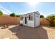 Charming shed with windows, set in a tranquil backyard, perfect for storage or a private retreat at 1425 E Darrel Rd, Phoenix, AZ 85042