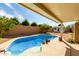 Sparkling pool with clear blue water, surrounded by a spacious patio and lush landscaping, ideal for summer fun at 1425 E Darrel Rd, Phoenix, AZ 85042