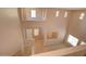 View of the two-story foyer with staircase, carpeted living room, and tiled hallway at 1524 N Milly Pl, Casa Grande, AZ 85122