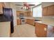 Bright kitchen featuring stainless steel appliances, wooden cabinets, and tile flooring at 1524 N Milly Pl, Casa Grande, AZ 85122