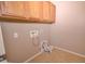 Laundry room area with hookups, cabinets, and tile flooring at 1524 N Milly Pl, Casa Grande, AZ 85122