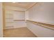 A walk-in closet featuring custom shelving and rods for ample storage space at 1524 N Milly Pl, Casa Grande, AZ 85122