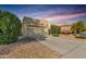 This single-story home has an attached garage, desert landscaping, and a well-manicured xeriscaped front yard at 15656 W Devonshire Ave, Goodyear, AZ 85395