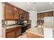 The kitchen showcases granite counters, stainless steel appliances, and dark wood cabinetry at 15656 W Devonshire Ave, Goodyear, AZ 85395
