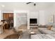 An open-concept space with stylish furnishings, a sectional sofa, and a glimpse into the kitchen at 15656 W Devonshire Ave, Goodyear, AZ 85395