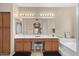 Spacious bathroom boasts a double vanity, soaking tub, and separate shower, illuminated by modern lighting at 16151 W Fairmount Ave, Goodyear, AZ 85395