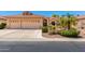 Charming single-story home featuring a three-car garage and lush landscaping, perfect for curb appeal at 16151 W Fairmount Ave, Goodyear, AZ 85395