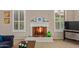 Elegant fireplace with a white mantel and decorative screen, adding warmth and charm to the living space at 16151 W Fairmount Ave, Goodyear, AZ 85395