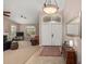 Welcoming foyer with tile flooring, leading into a spacious living area filled with natural light at 16151 W Fairmount Ave, Goodyear, AZ 85395