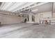 Spacious garage with ample storage cabinets, shelving, and room for multiple vehicles at 16151 W Fairmount Ave, Goodyear, AZ 85395