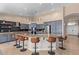 Bright kitchen features granite counters, stainless appliances, and a large center island with seating at 16151 W Fairmount Ave, Goodyear, AZ 85395