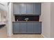 Charming hallway features cabinetry, providing organized storage solutions and enhancing the home's functionality at 16151 W Fairmount Ave, Goodyear, AZ 85395