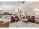 Spacious living room with a view of the kitchen, featuring stylish decor and ample seating for relaxation at 16151 W Fairmount Ave, Goodyear, AZ 85395