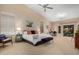 Spacious main bedroom boasts natural light, a seating area, and ample room for relaxation and personalization at 16151 W Fairmount Ave, Goodyear, AZ 85395
