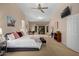 Large main bedroom offers bright lighting, space for a desk, and a door to the outside at 16151 W Fairmount Ave, Goodyear, AZ 85395