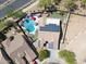 Aerial view of a home with solar panels, a private pool, well landscaped yard, and great curb appeal at 16511 W Cortez St, Surprise, AZ 85388
