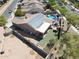 Home with solar panels and fenced backyard featuring pool, spa, covered patio, and desert landscaping at 16511 W Cortez St, Surprise, AZ 85388
