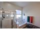 Bright bathroom features a separate shower and tub, with a window for natural light at 16511 W Cortez St, Surprise, AZ 85388