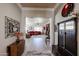 Open-concept floor plan showcasing the living area with stylish decor and hardwood floors at 16511 W Cortez St, Surprise, AZ 85388