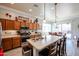 Beautiful kitchen with stainless steel appliances, a center island, and pendant lights at 16511 W Cortez St, Surprise, AZ 85388