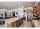 Well-designed kitchen with stainless appliances opens to living and dining areas at 16511 W Cortez St, Surprise, AZ 85388