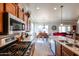 Well-equipped kitchen with island, stainless steel appliances and cabinetry at 16511 W Cortez St, Surprise, AZ 85388
