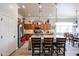 Bright kitchen with stainless steel appliances, breakfast bar, and pendant lighting at 16511 W Cortez St, Surprise, AZ 85388