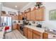 Updated kitchen showcasing stainless appliances, light countertops, and plenty of cabinet space at 16511 W Cortez St, Surprise, AZ 85388