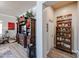 Living room view with decorative shelving, modern furniture, and wood-look floors at 16511 W Cortez St, Surprise, AZ 85388