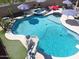 Lovely pool features a spa, slide, and diving board and is surrounded by lush landscaping, creating a private retreat at 16511 W Cortez St, Surprise, AZ 85388