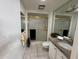Clean bathroom with a tiled shower, granite countertops, and updated fixtures at 18211 N Conestoga Dr, Sun City, AZ 85373